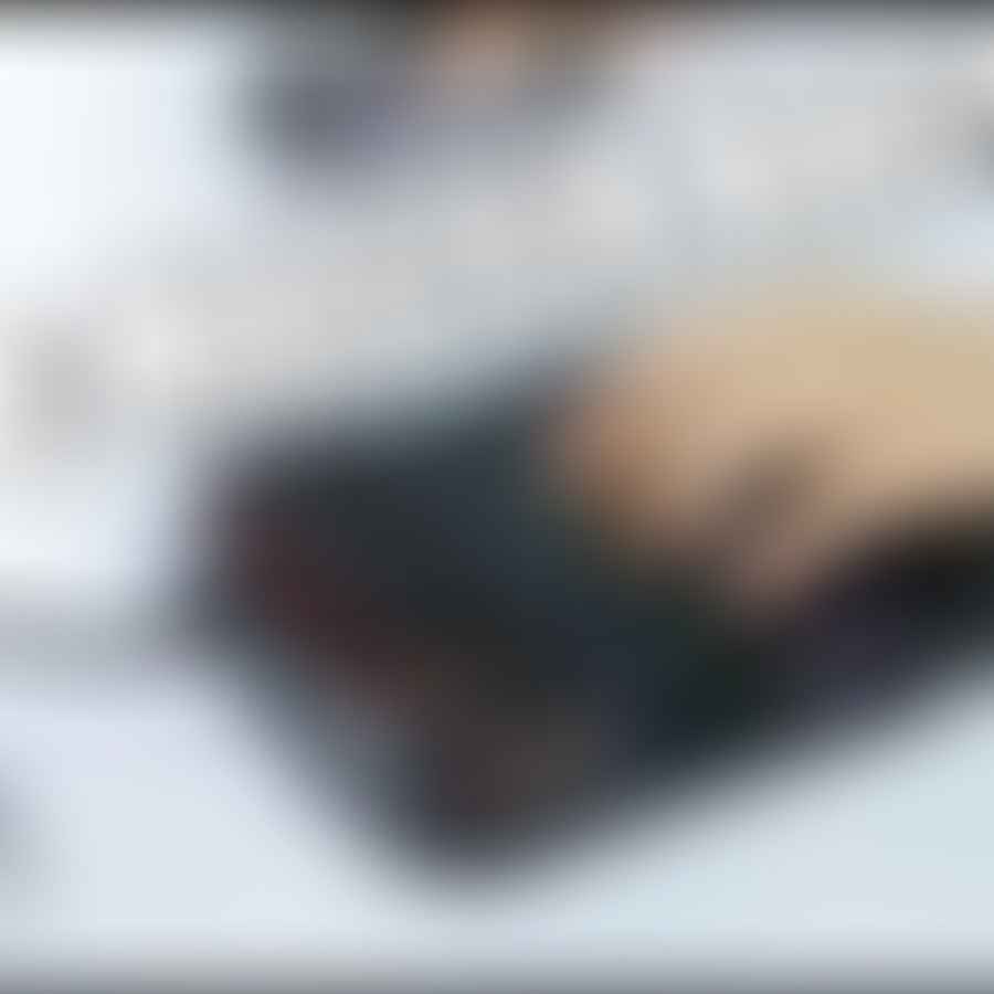 Close-up image of a disabled person\'s hand using a one-handed keyboard